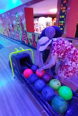 Gid having a go at 10 pin bowling Gid having a go at 10 pin bowling